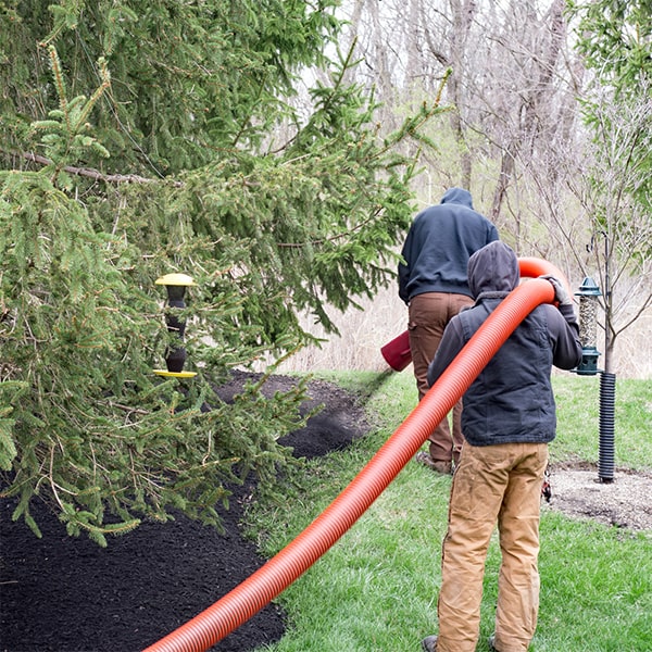 mulch blowing is a sustainable method that helps conserve water, control weeds, and enrich the soil with organic matter